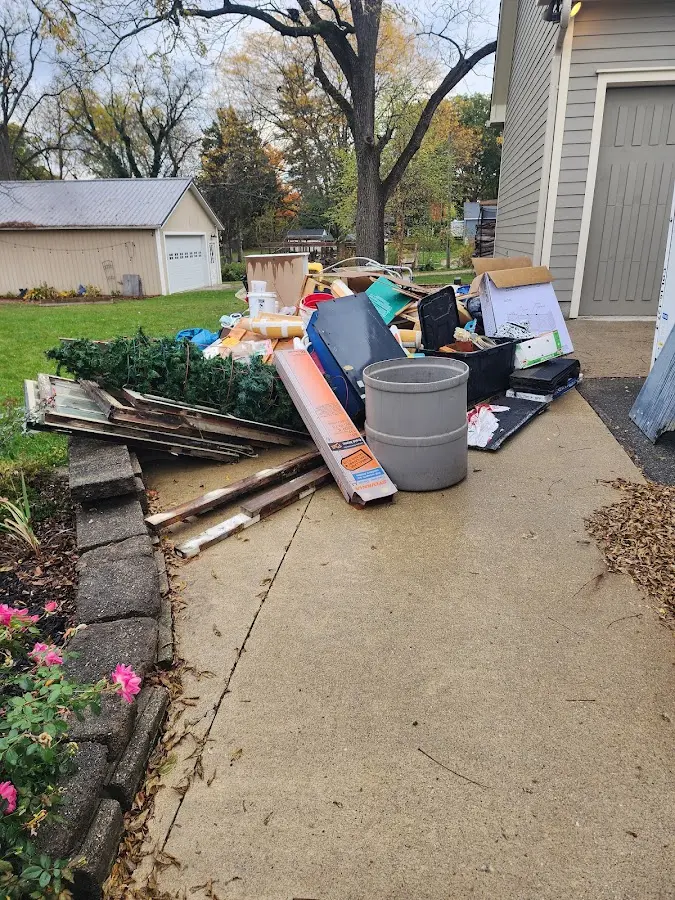 Dumpster being loaded with debris for Commercial Dumpster Rental in Park City